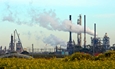 A factory with emissions from smoke stacks.